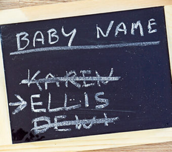 Chalkboard with baby names written on it, one name crossed out