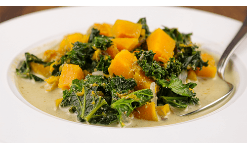 closeup of bowl filled with Butternut Squash, Kale & Quinoa Stew