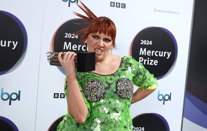 CMAT poses with an Album of the Year award during a photocall for the 2024 Mercury Music Prize 'Album of the Year' at The Langham Hotel on July 25, 2024 in London, England. (Photo by JMEnternational/Getty Images)