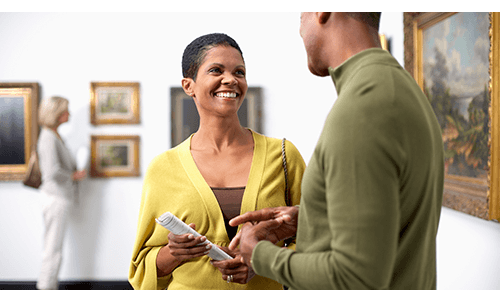 Couple smiling together at an art museum