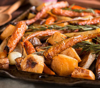 Closeup of sheet pan full of roasted vegetables