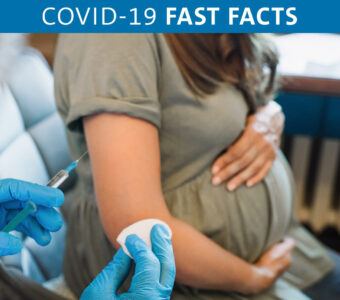 Pregnant person receiving COVID-19 vaccine shot