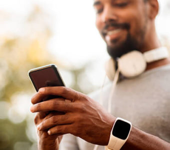 Closeup of person using a mobile phone during a workout