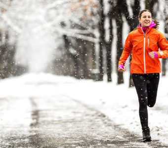 Woman running outside during the winter