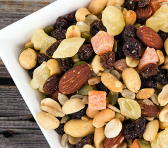 Bowl of trail mix with nuts and dried fruit