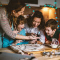 Family baking holiday cookies together