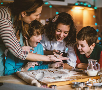 Family baking holiday cookies together