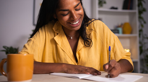 Person writing in a journal