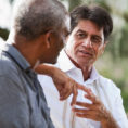 Two men in a conversation outdoors