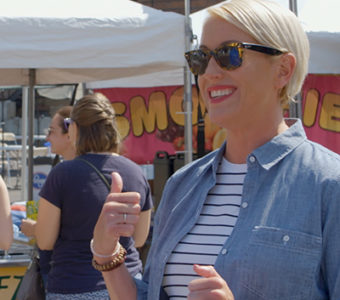 Woman talking to nutritionist while walking through fair