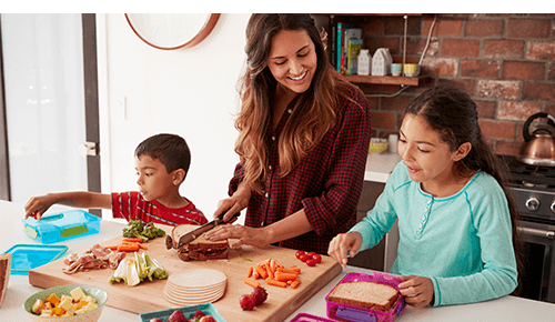 Mother and Children Making School Lunches