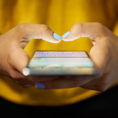 Closeup of person typing on a smart phone