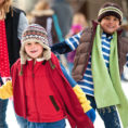 Children ice skating outdoors