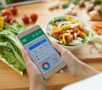 Person using smart phone app to track food and look at nutritional values