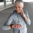 Person checking their heart rate while exercising outdoors