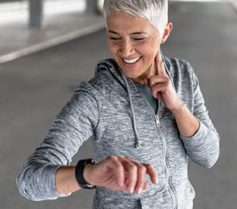 Person checking their heart rate while exercising outdoors