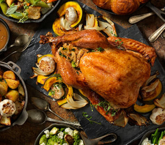 Table full of Thanksgiving turkey and food dishes