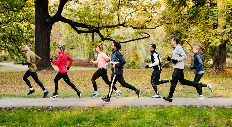 Group of people running outdoors