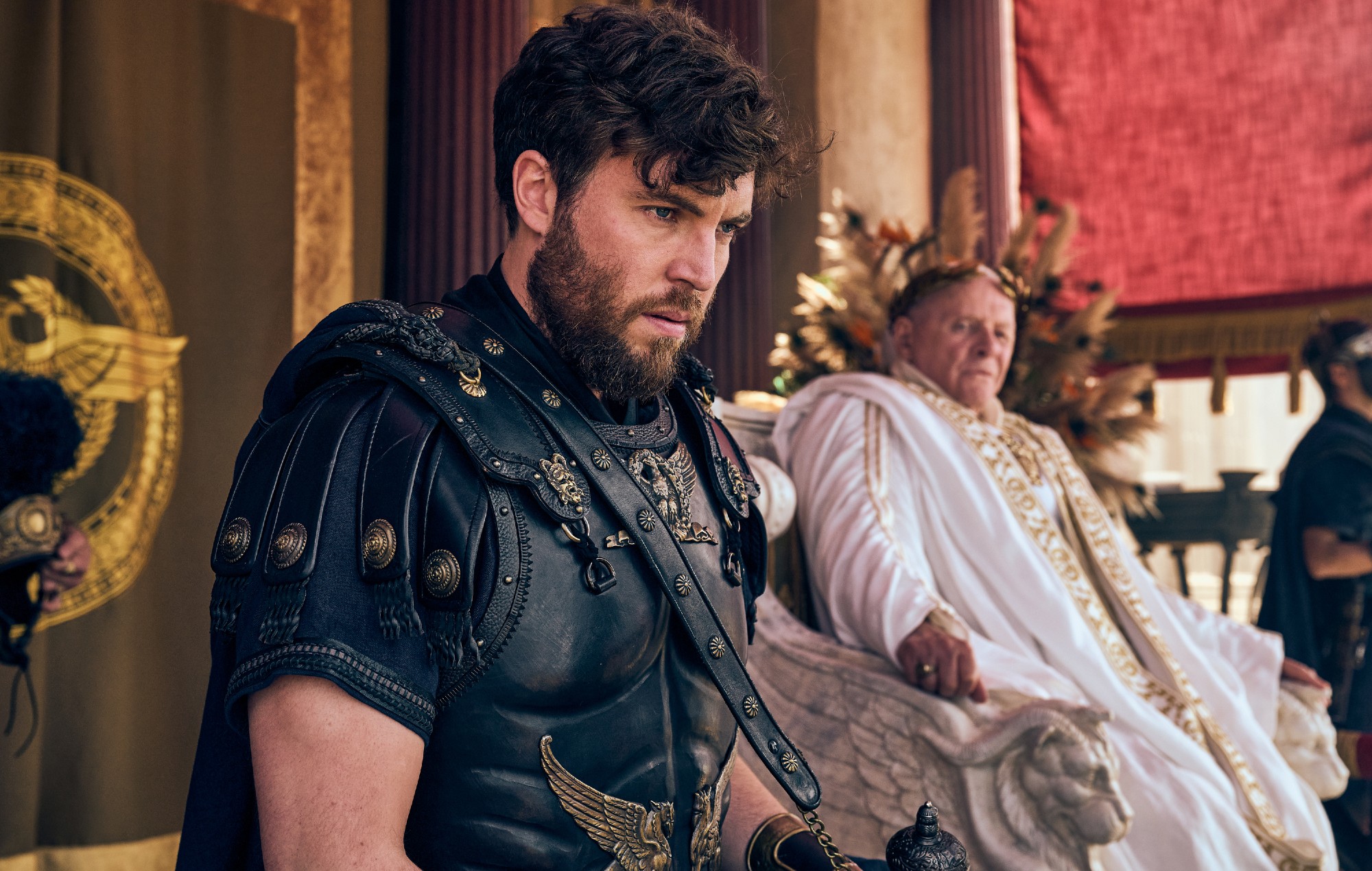 Tom Hughes as Titus and Anthony Hopkins as Emperor Vespasian in 'Those About to Die'.