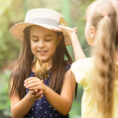 Two children in butterfly greenhouse