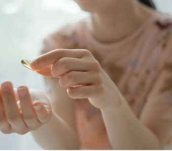 Woman taking medicine pill