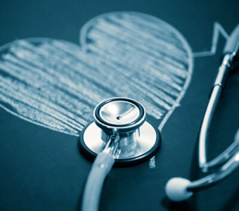 Chalkboard drawing of heart with stethoscope sitting on top